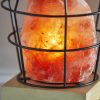 Himalayan Salt Table Lamp With Black Wire Basket - Image 2